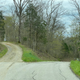 This driveway is what’s known to those in my line of work as a “tease”. You come up a hill, around the corner, and think the road is turning into a hilly dirt road...but no